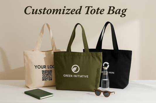 Three custom tote bags with printed logos and QR codes displayed on a white surface with a notebook, sunglasses, and water bottle, against a beige background.