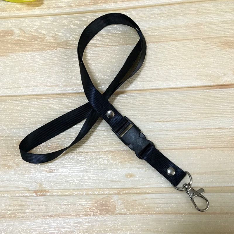 Black custom nylon lanyard with a detachable plastic buckle, silver button snaps, and a metal lobster clip, arranged in a loop on a white background.