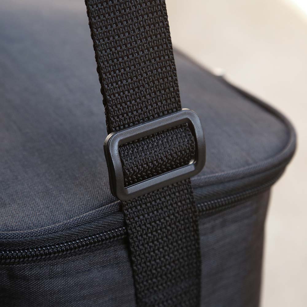 Close-up view of adjustable black strap and buckle on an insulated cooler bag