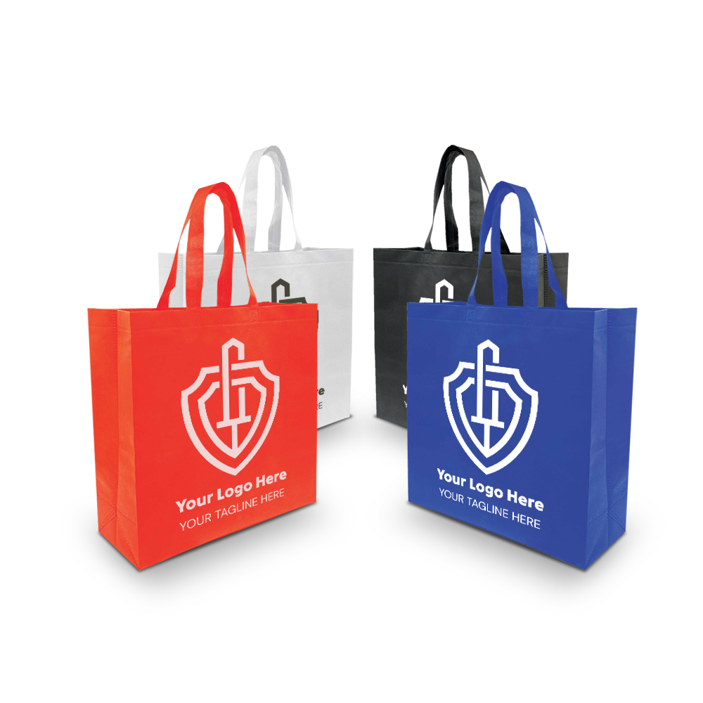 Four reusable tote bags in red, white, black, and blue, each with a shield-style custom logo and tagline on the front.