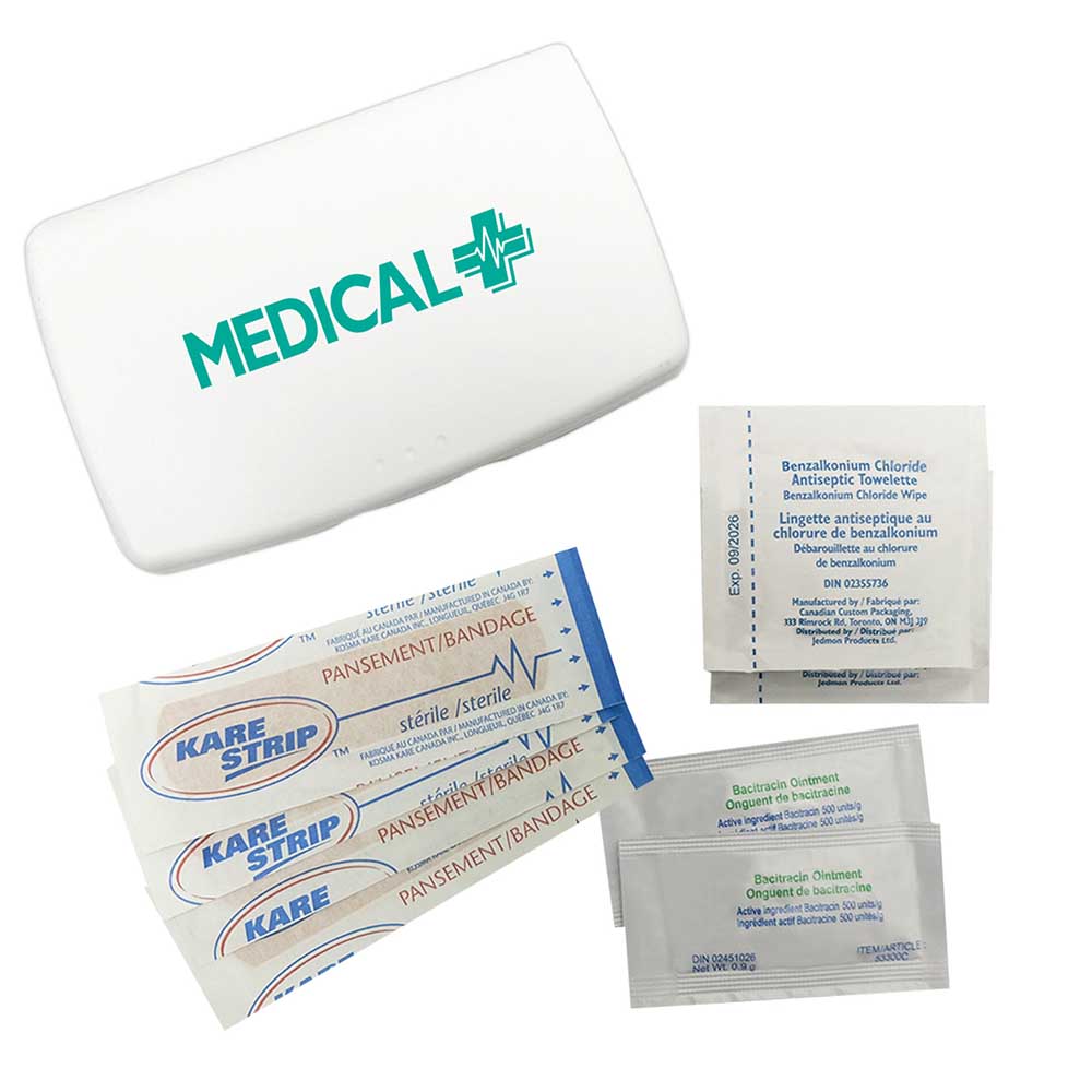 Red first aid kit with MusicFest logo, includes bandages, antiseptic wipes, and ointment packets.