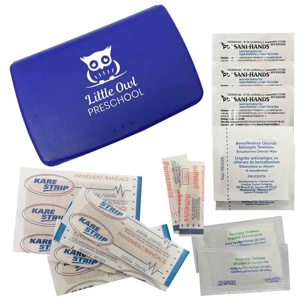 Blue first aid case with “Little Owl Preschool” logo, displayed with bandages, sanitizing wipes, and antibiotic ointments