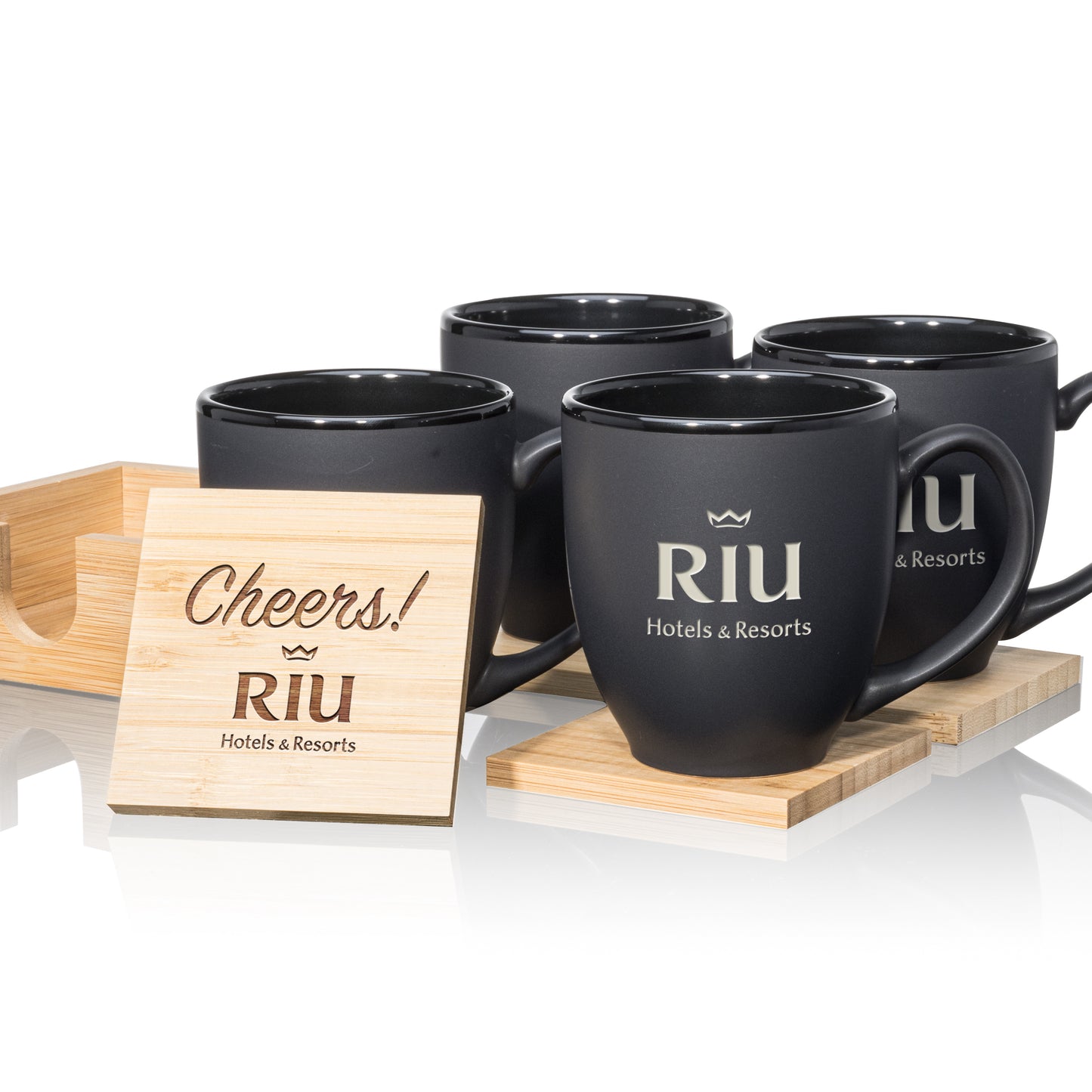 Matte black mugs with black interiors, paired with engraved wooden coasters in a stylish gift set.