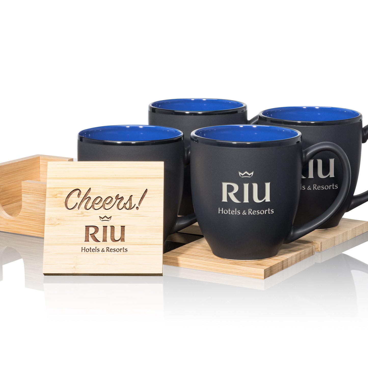 Matte black mugs with blue interiors, paired with engraved wooden coasters in a stylish gift set.