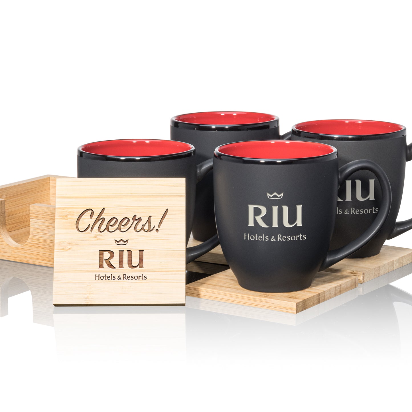 Matte black mugs with red interiors, paired with engraved wooden coasters in a stylish gift set.