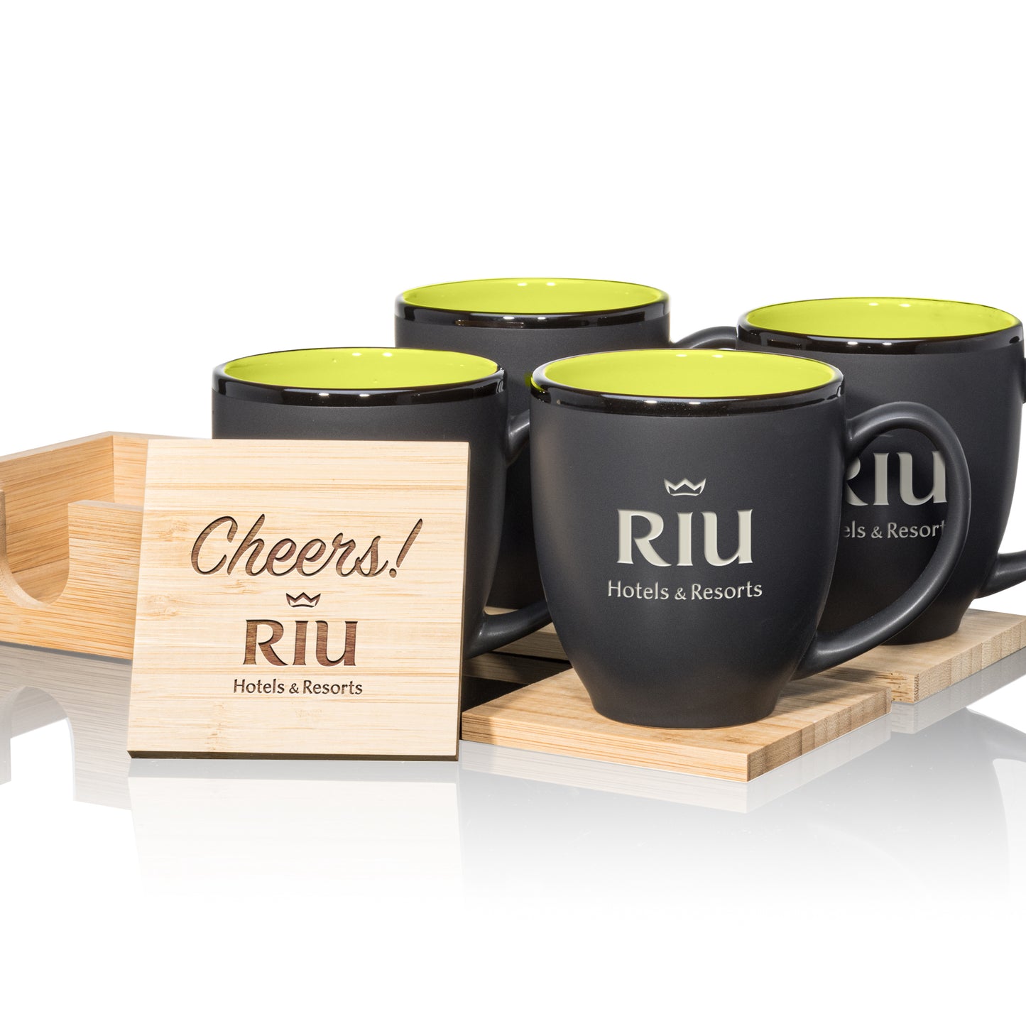 Matte black mugs with green interiors, paired with engraved wooden coasters in a stylish gift set.