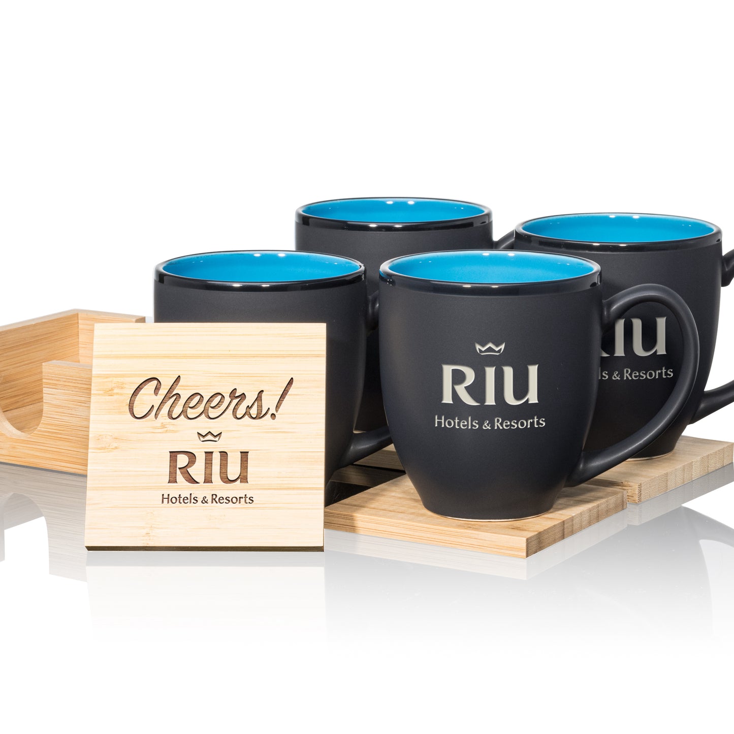 Matte black mugs with vibrant blue interiors, paired with engraved wooden coasters in a stylish gift set.