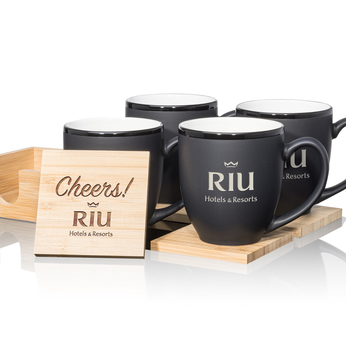 Matte black mugs with white interiors, paired with engraved wooden coasters in a stylish gift set.