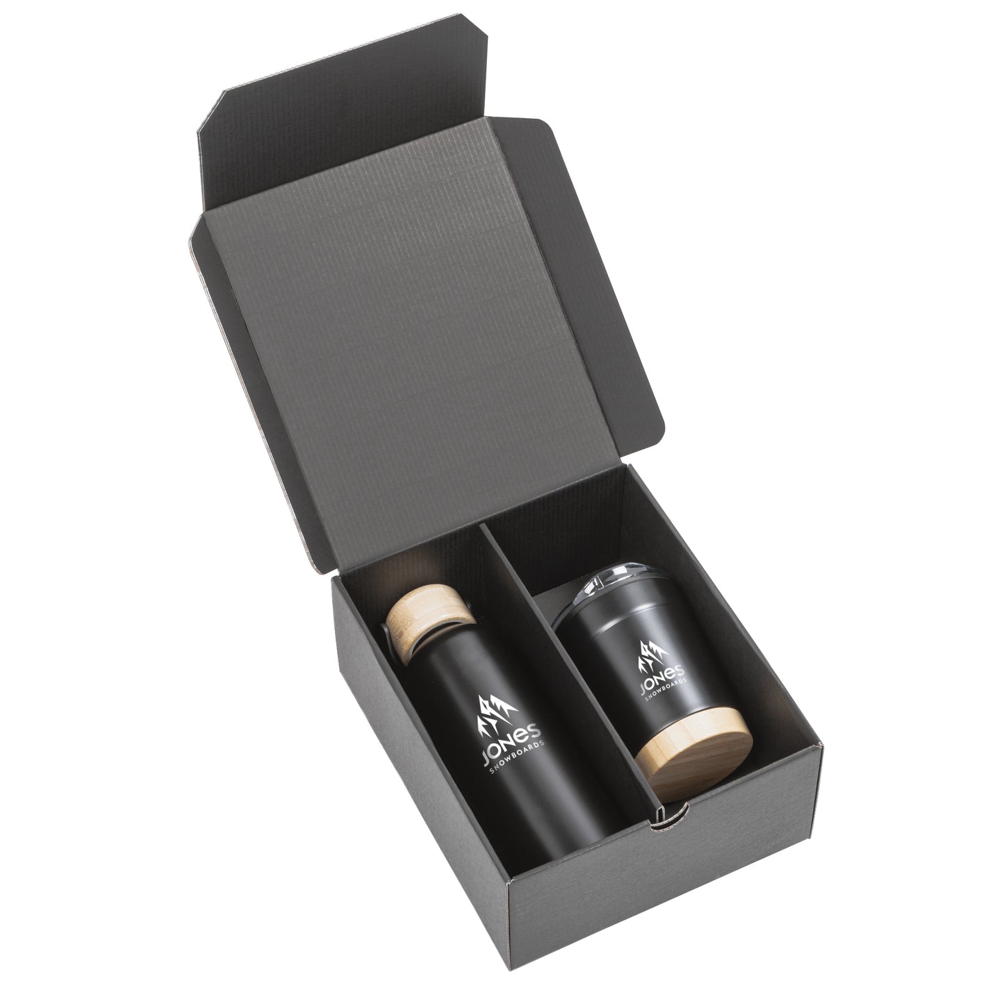 Black gift box containing a matte black stainless steel bottle with a bamboo lid and a matching tumbler with bamboo base and clear lid, both branded with the Jones Snowboards logo in white.