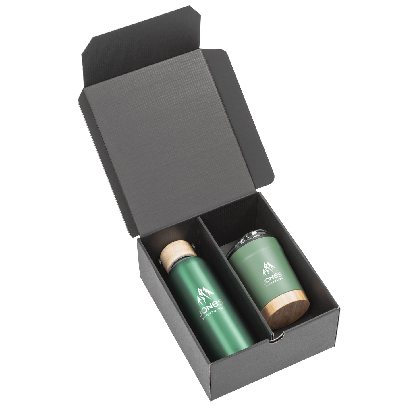 Black gift box containing a matte forest green stainless steel bottle with a bamboo lid and a matching tumbler with bamboo base and clear lid, both branded with the Jones Snowboards logo in white.