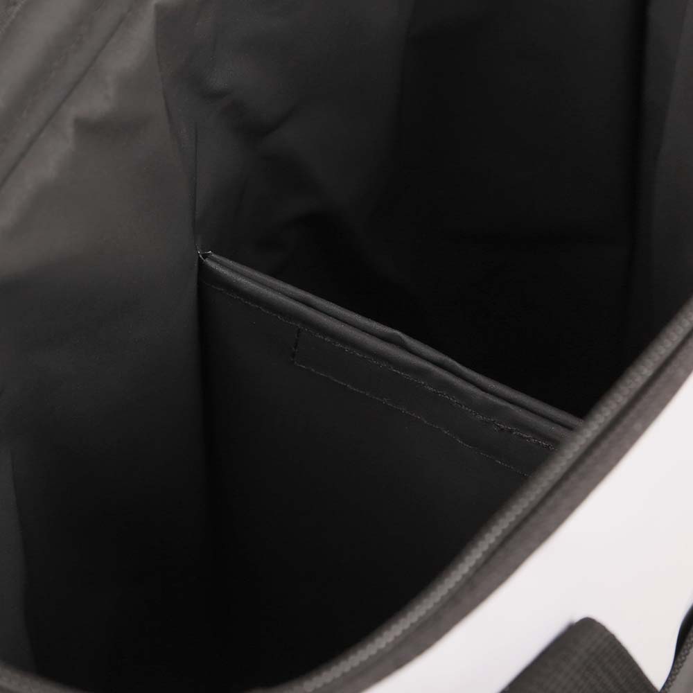 Close-up top view of insulated tote bag interior with built-in divider – showcases spacious and organized bottle storage design