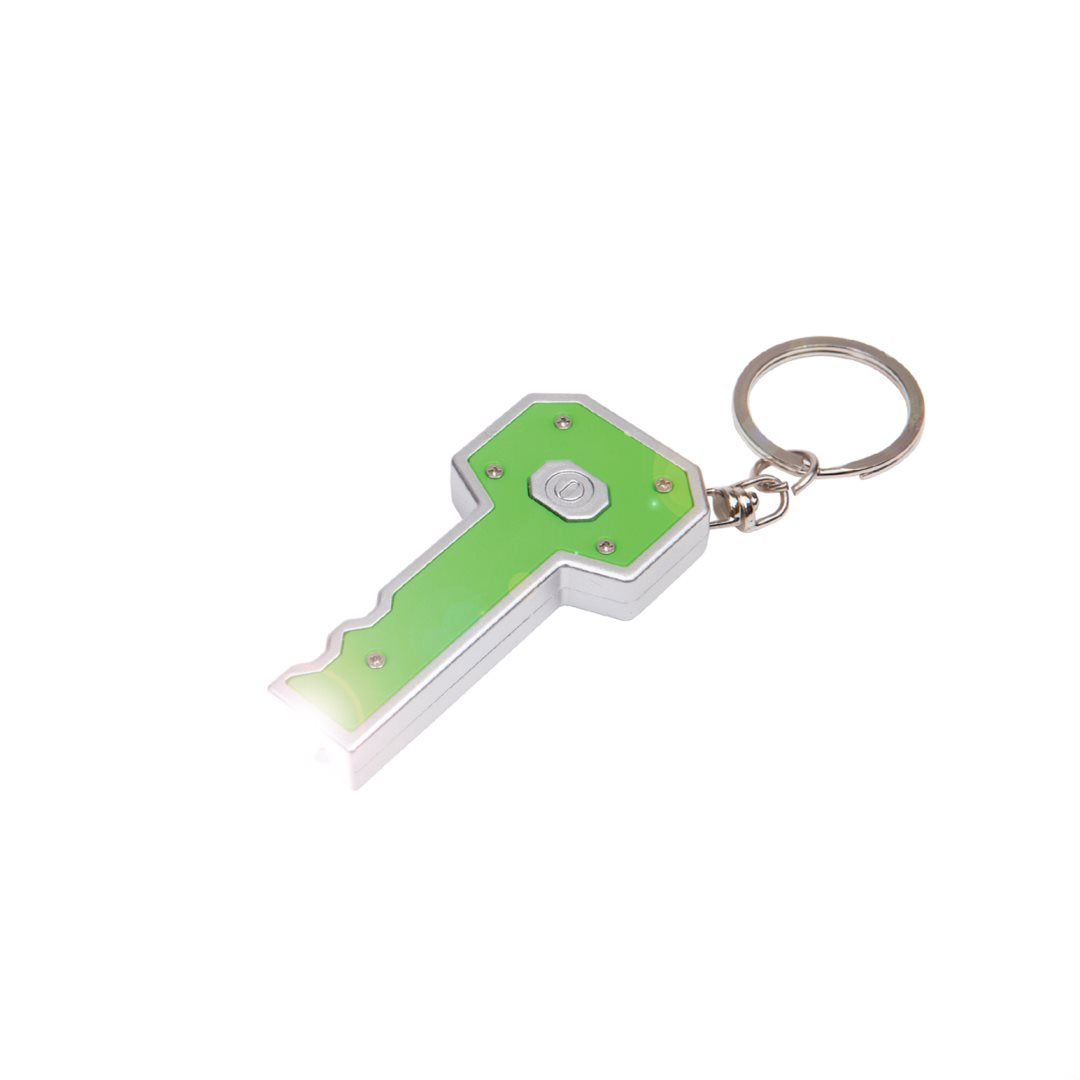 Back view of the Key LED Flashlight keychain in silver and green, showing the LED light in use and centered activation button with metal keyring attachment.