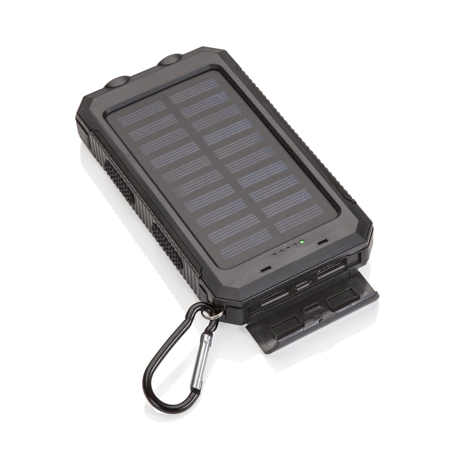 Angled view of a black solar power bank with a large solar panel, visible indicator lights, open protective port cover showing USB ports, and a metal carabiner attached to the corner.