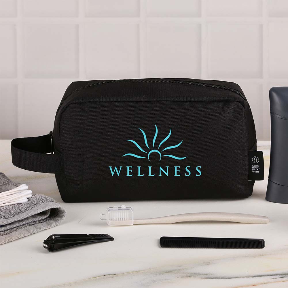 Black custom toiletry bag with a customized logo, displayed on a bathroom counter