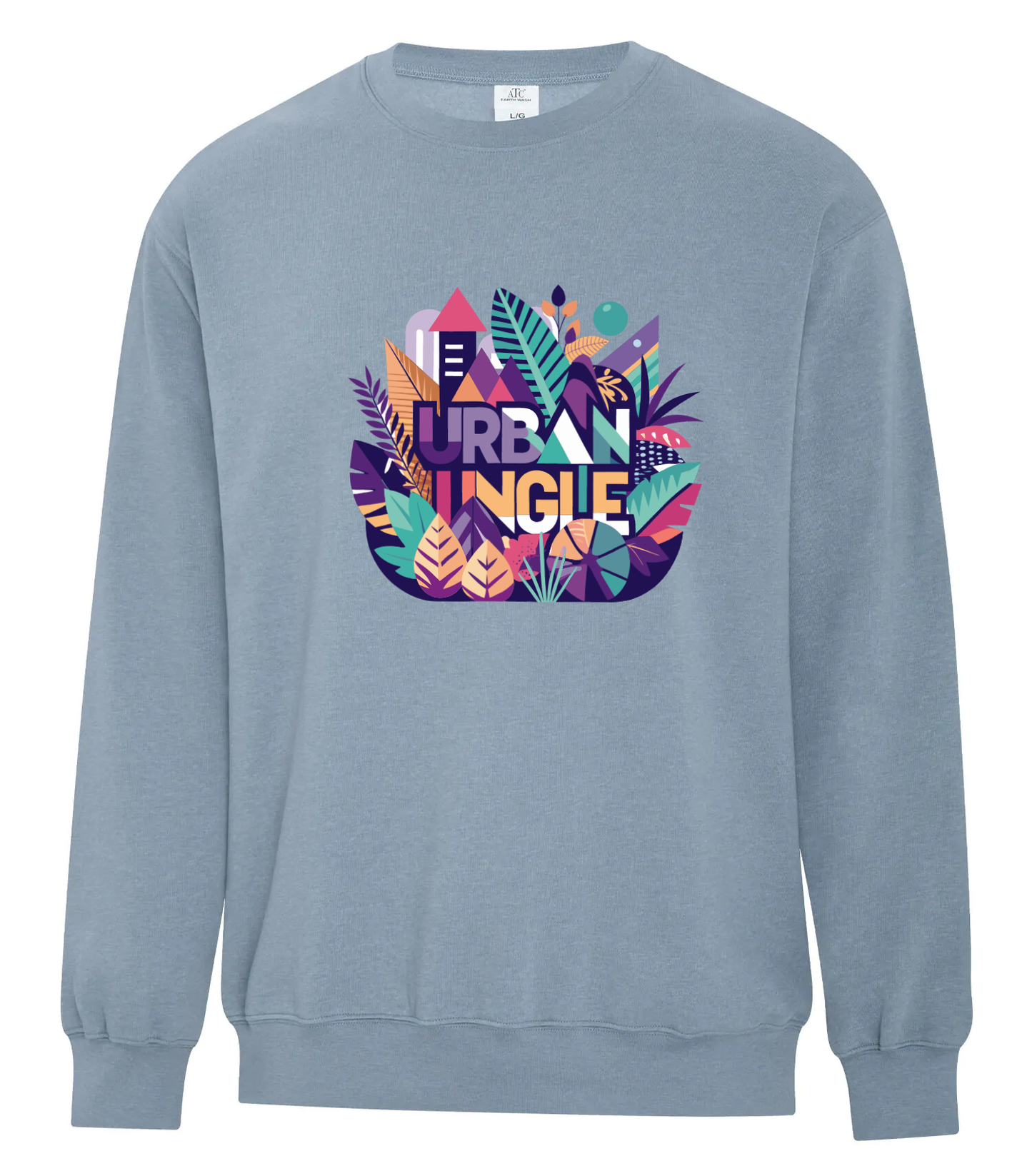 Light blue crewneck sweatshirt featuring a colorful 'Urban Jungle' graphic centered on the chest, combining vivid botanical elements and geometric buildings with bold purple, orange, and teal accents.