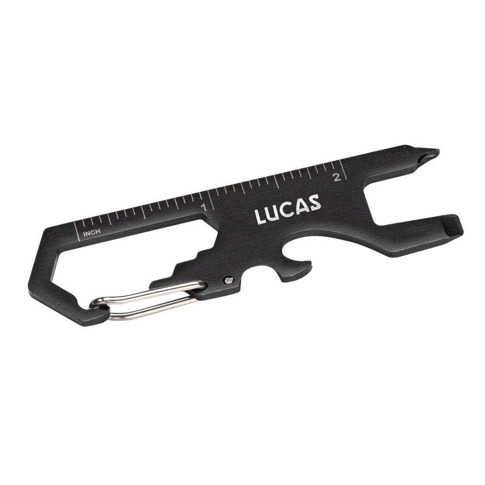Back angle of the Claude Multi Tool with built-in inch ruler, showing the multi-functional black metal tool with carabiner clip, screwdriver, bottle opener, wrench slots, and 'LUCAS' logo engraving