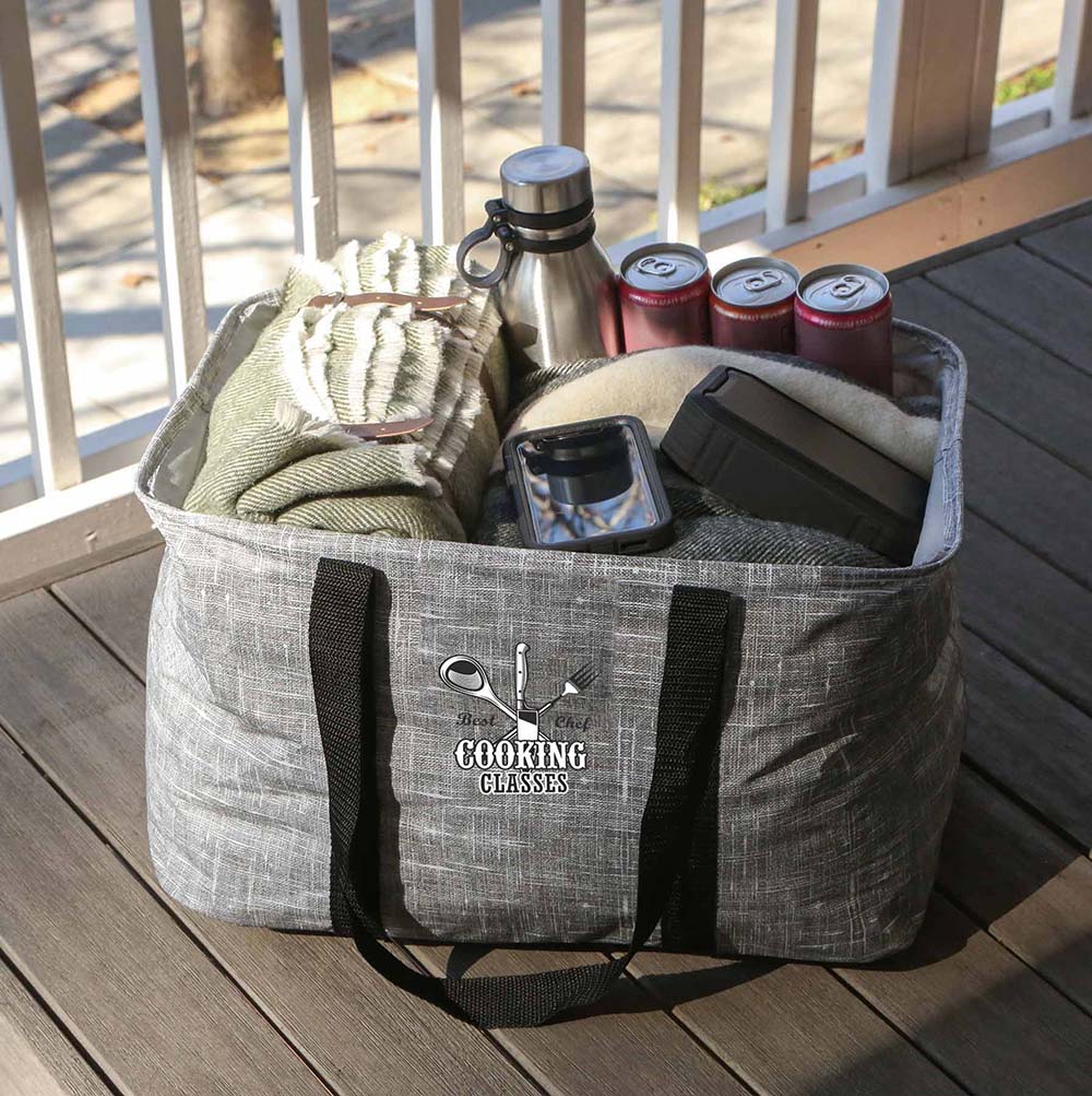 Large gray non-woven collapsible tote bag with a customized logo, filled with everyday essentials.