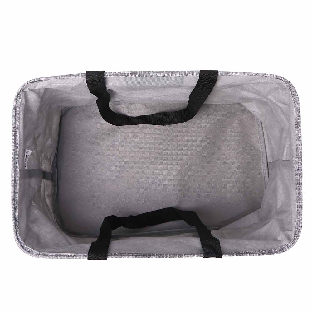 Top-down view of the interior of a rectangular grey fabric tote bag with black carrying straps