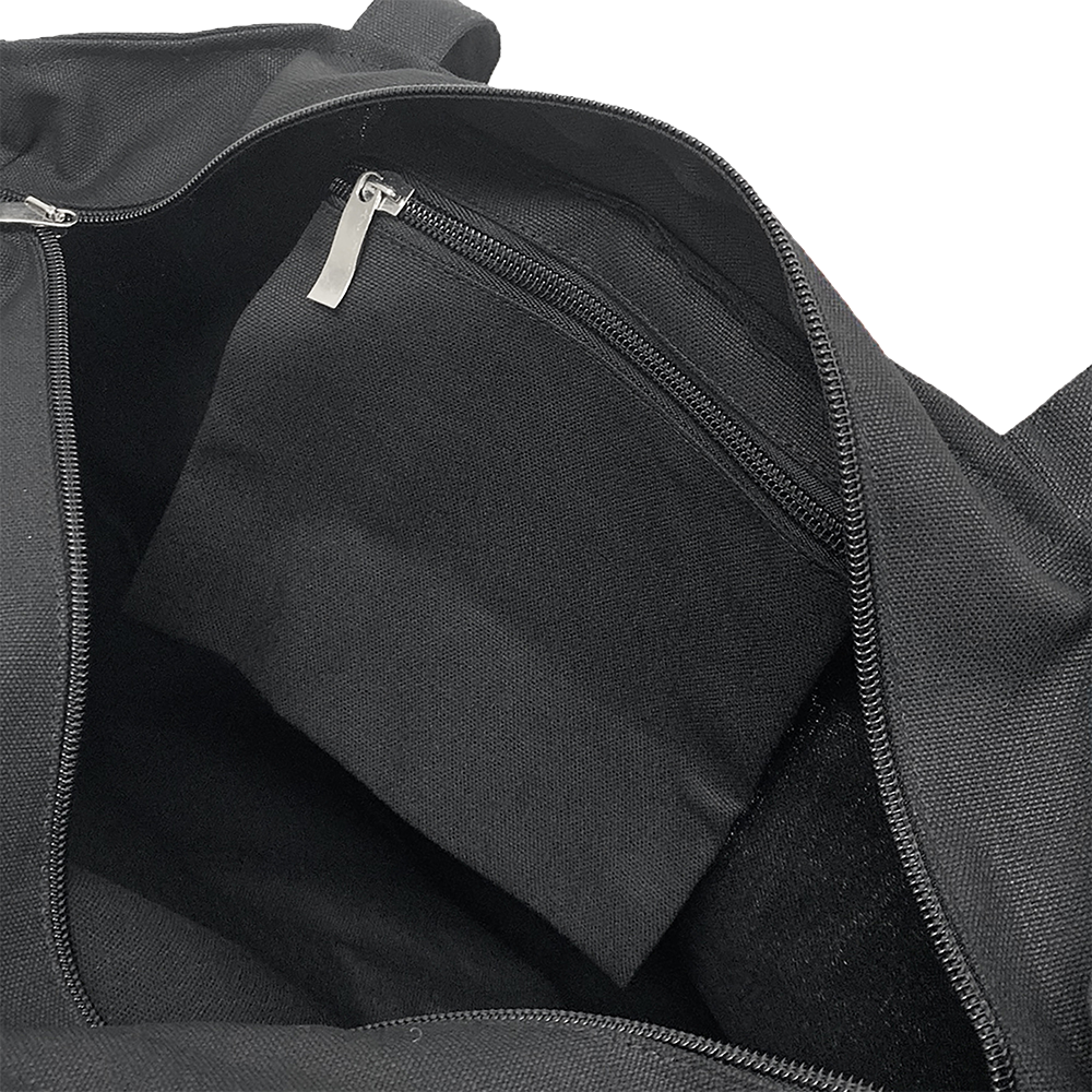 Interior view of black tote bag with a zippered pocket.