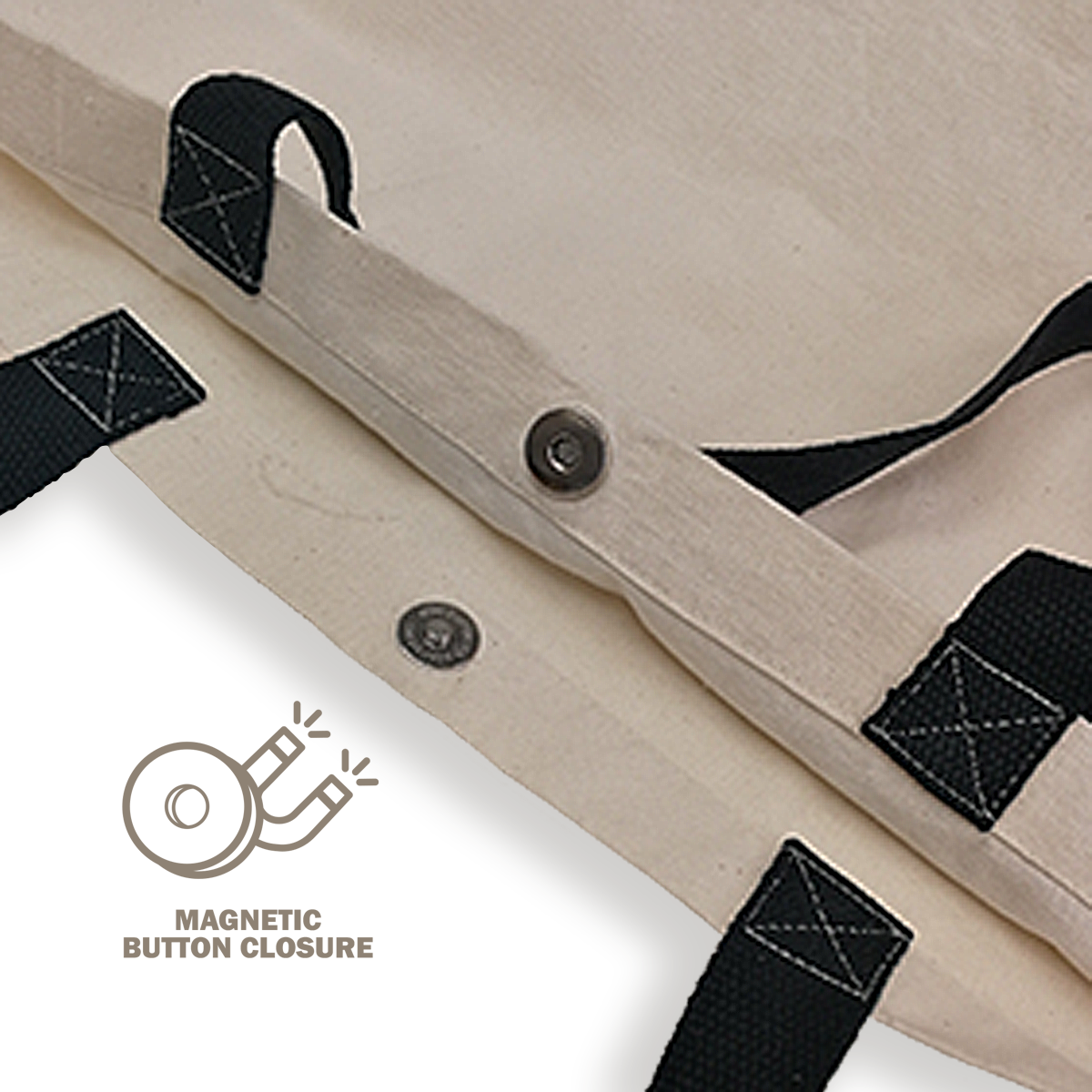 Close-up of magnetic button closure on canvas tote bag with reinforced black handles.
