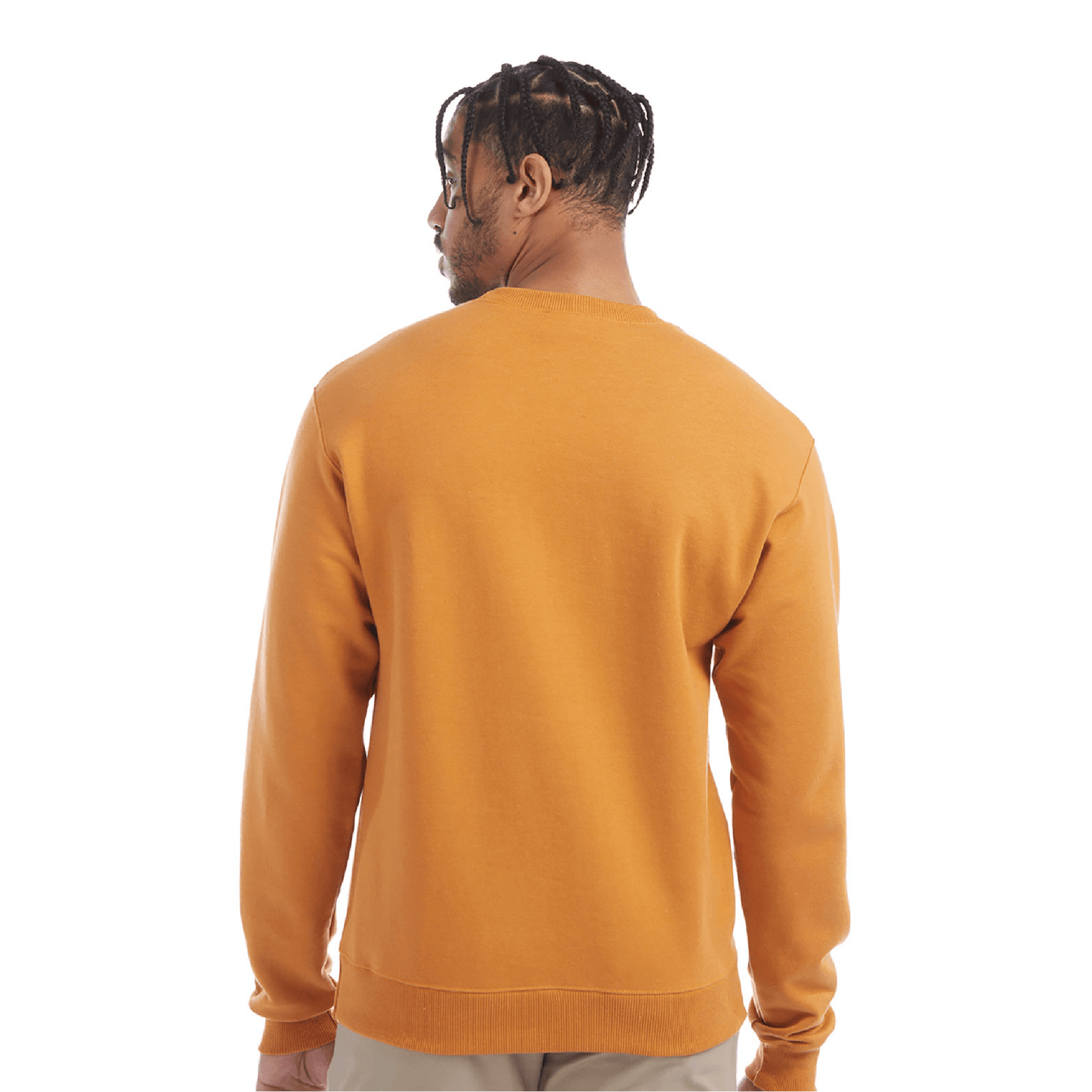 Back view of a man wearing a golden yellow crewneck sweatshirt with ribbed cuffs and hem, paired with light beige pants.