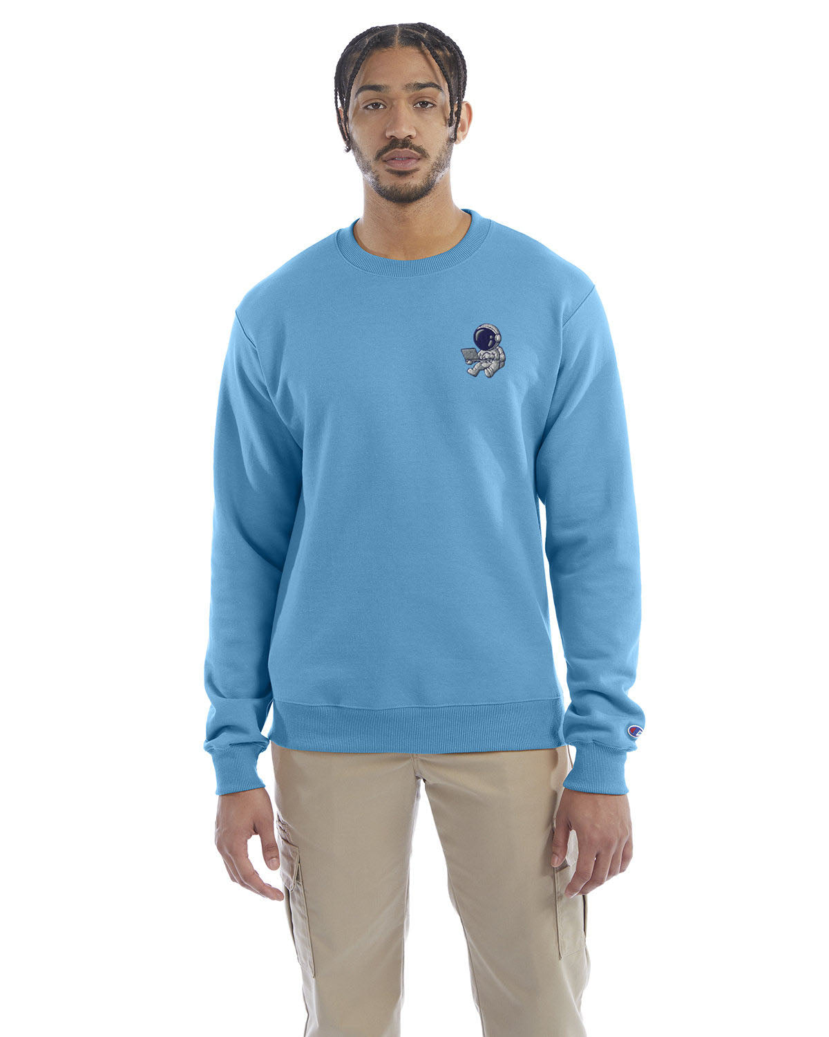 Model wearing blue lagoon Champion crewneck sweatshirt with custom chest logo.