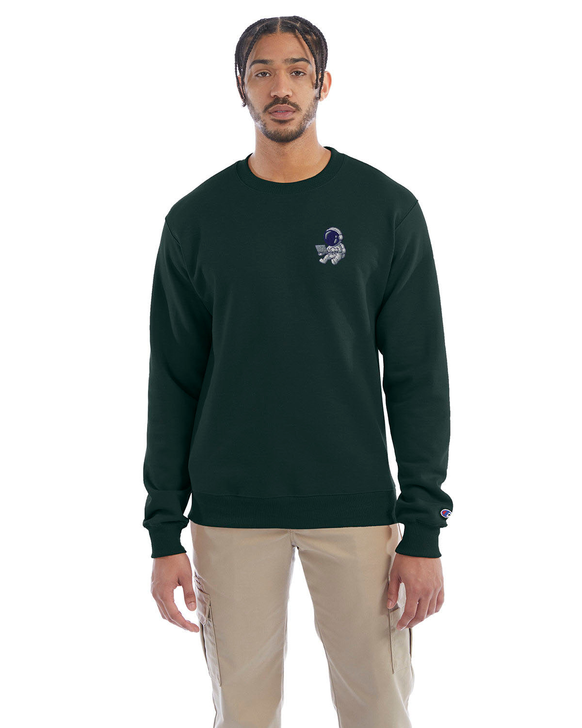 Model wearing forest green Champion crewneck sweatshirt with custom chest logo