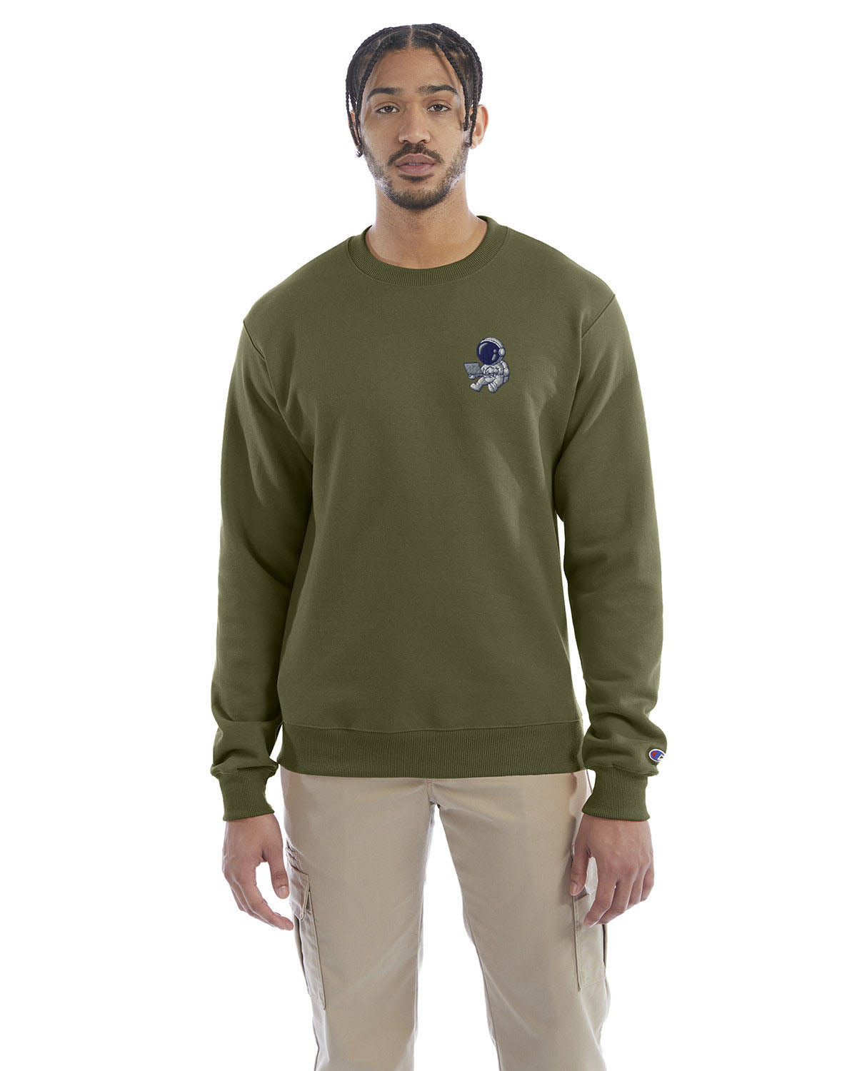 Model wearing fresh olive Champion crewneck sweatshirt with custom chest logo.
