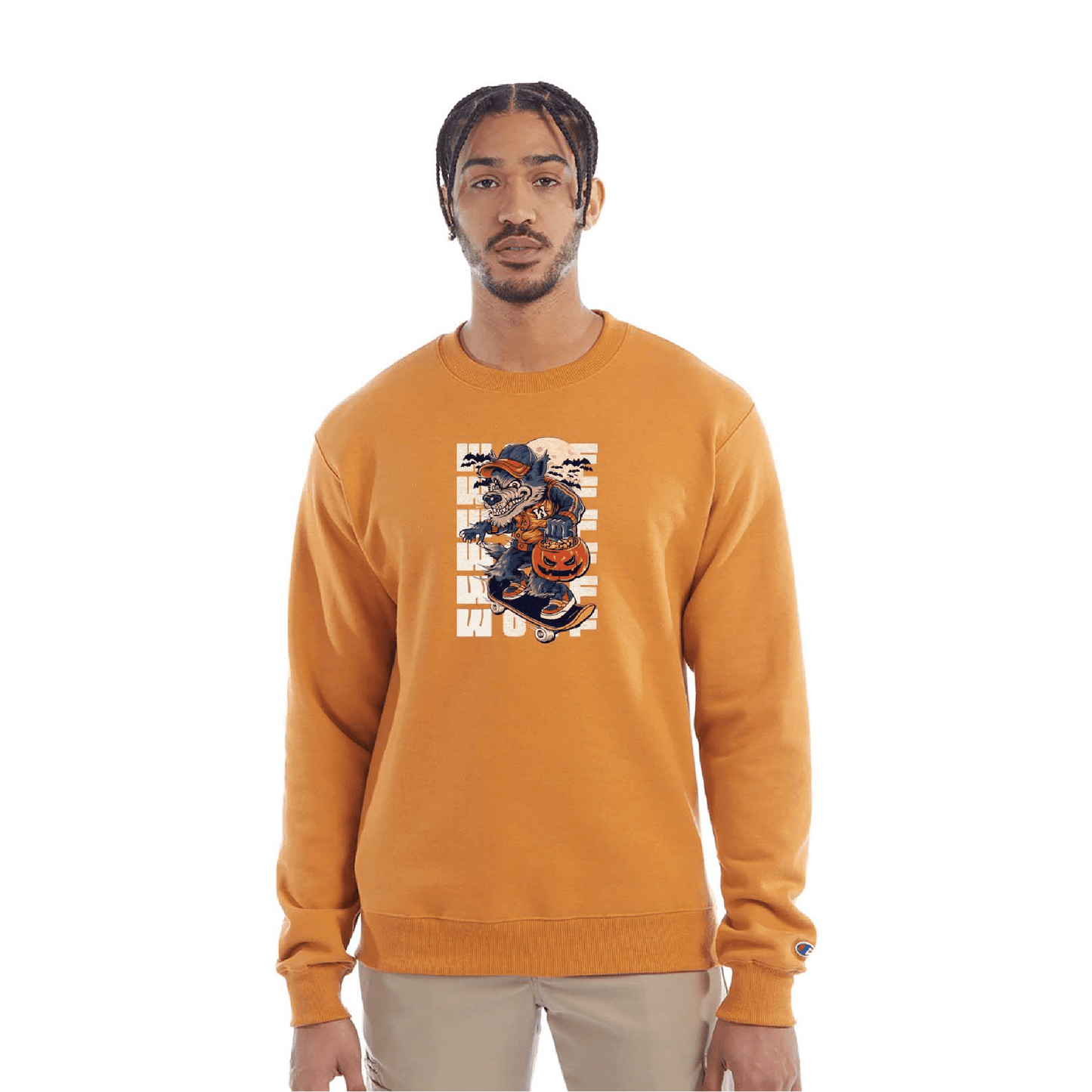 Golden yellow crewneck sweatshirt with a Halloween-themed graphic of a cartoon werewolf skateboarding with a pumpkin basket, worn by a model in beige pants.