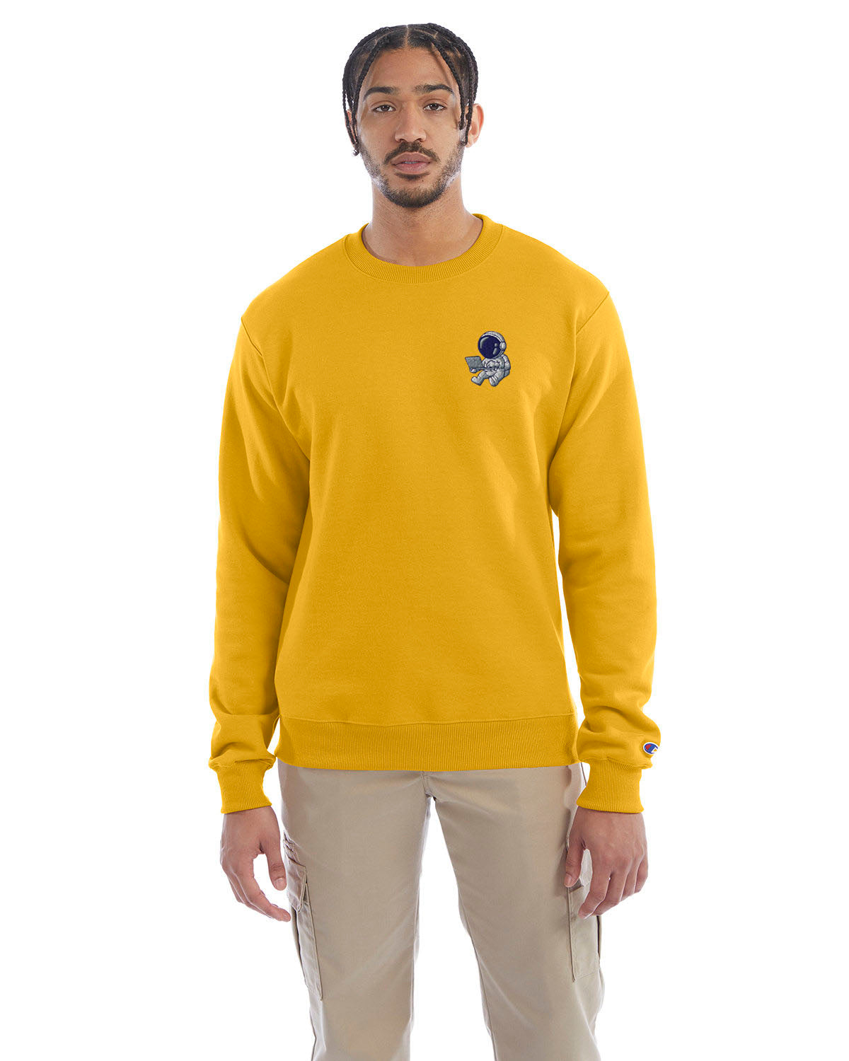 Model wearing gold Champion crewneck sweatshirt with custom chest logo.