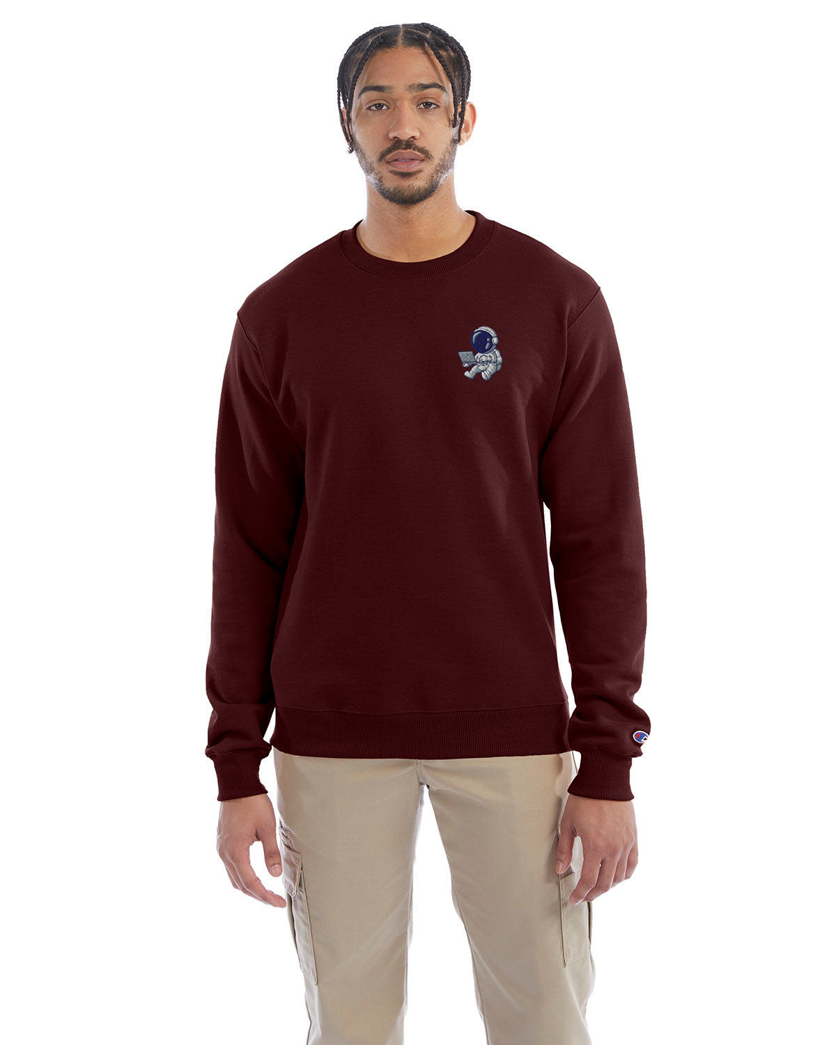 Model wearing maroon Champion crewneck sweatshirt with custom chest logo.