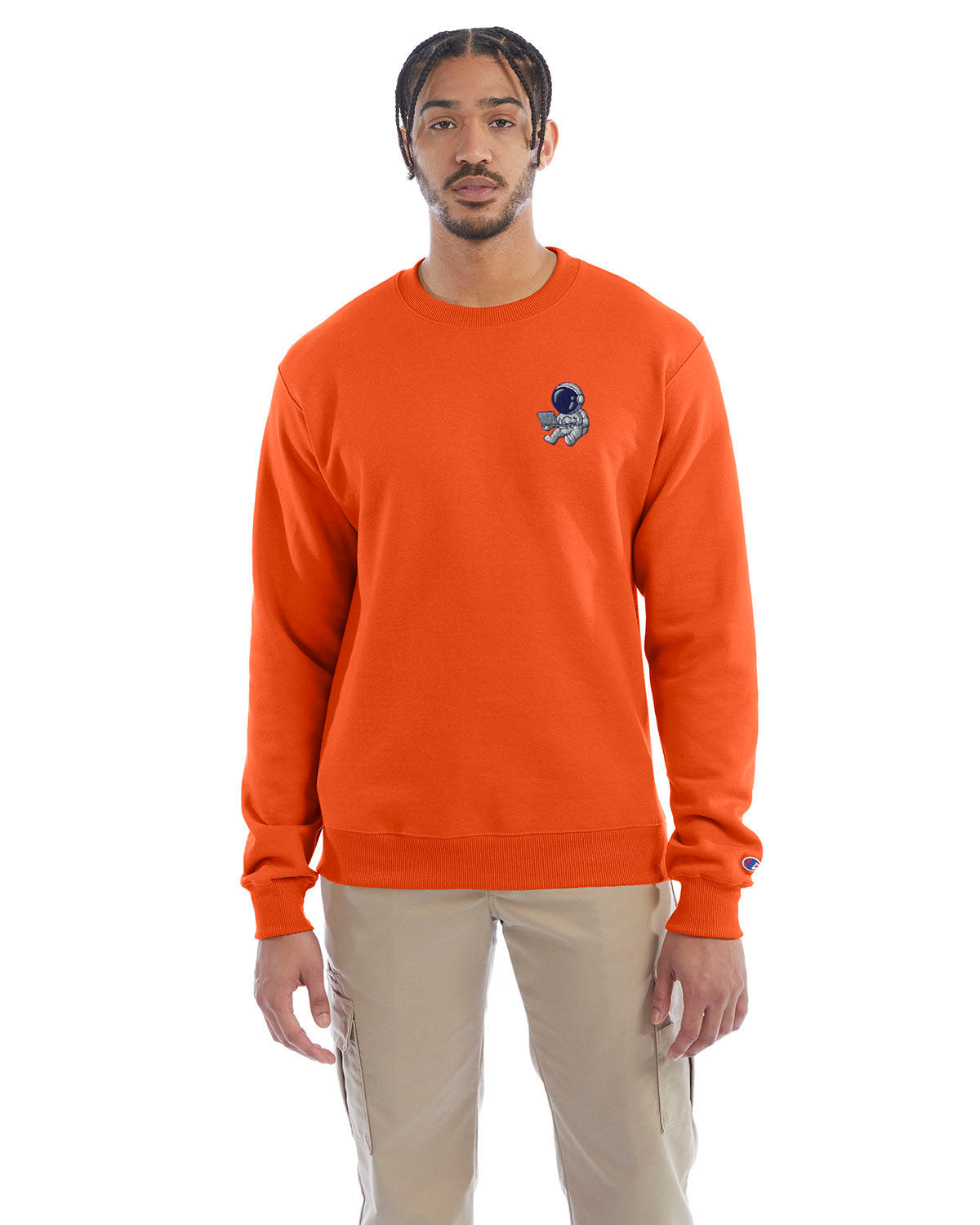 Model wearing orange Champion crewneck sweatshirt with custom chest logo.