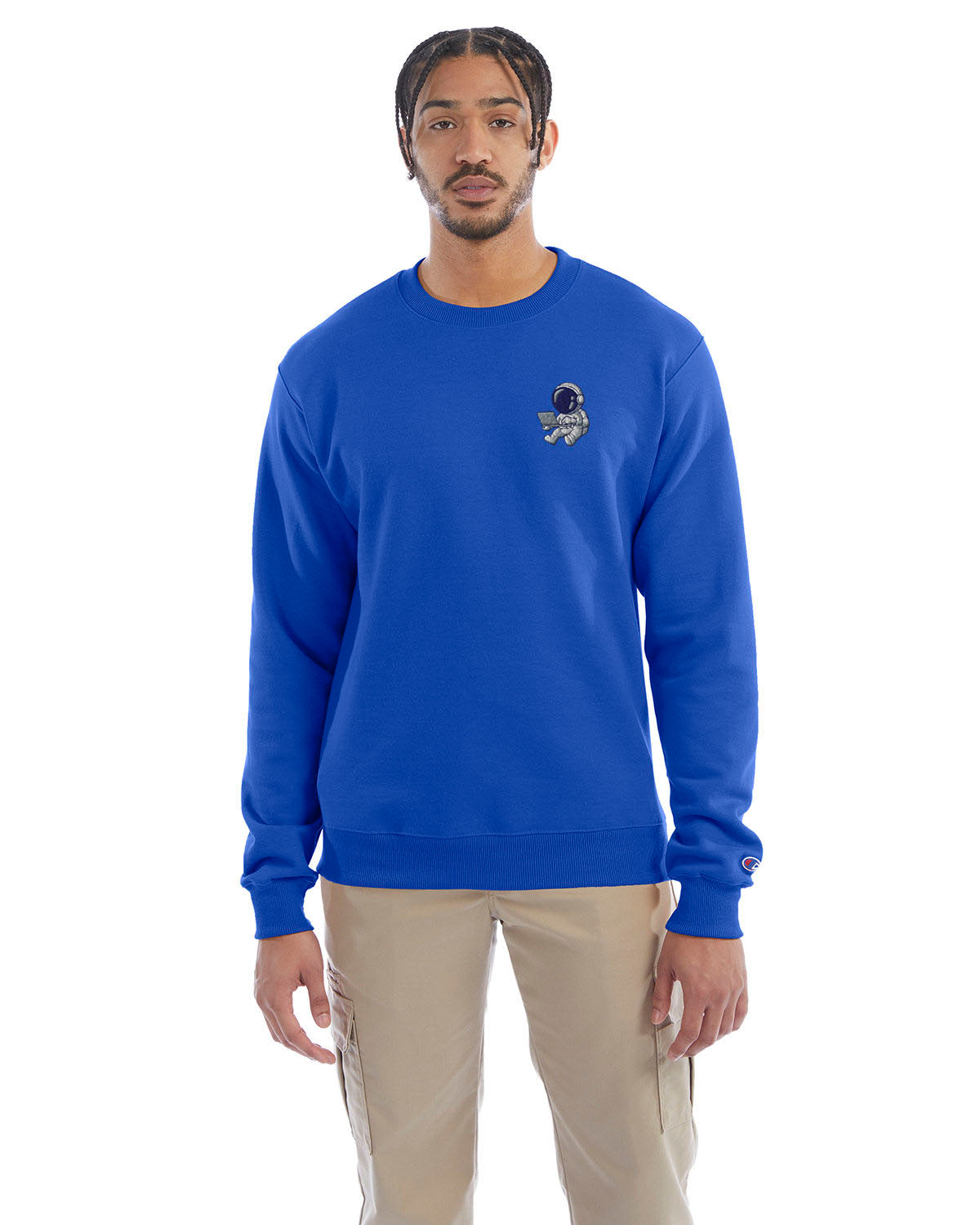 Model wearing royal blue Champion crewneck sweatshirt with custom chest logo.