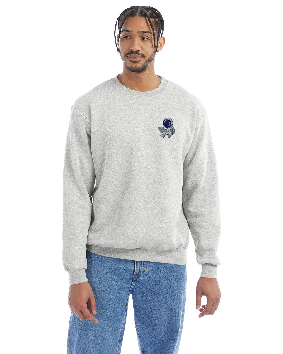 Model wearing silver grey Champion crewneck sweatshirt with custom chest logo.