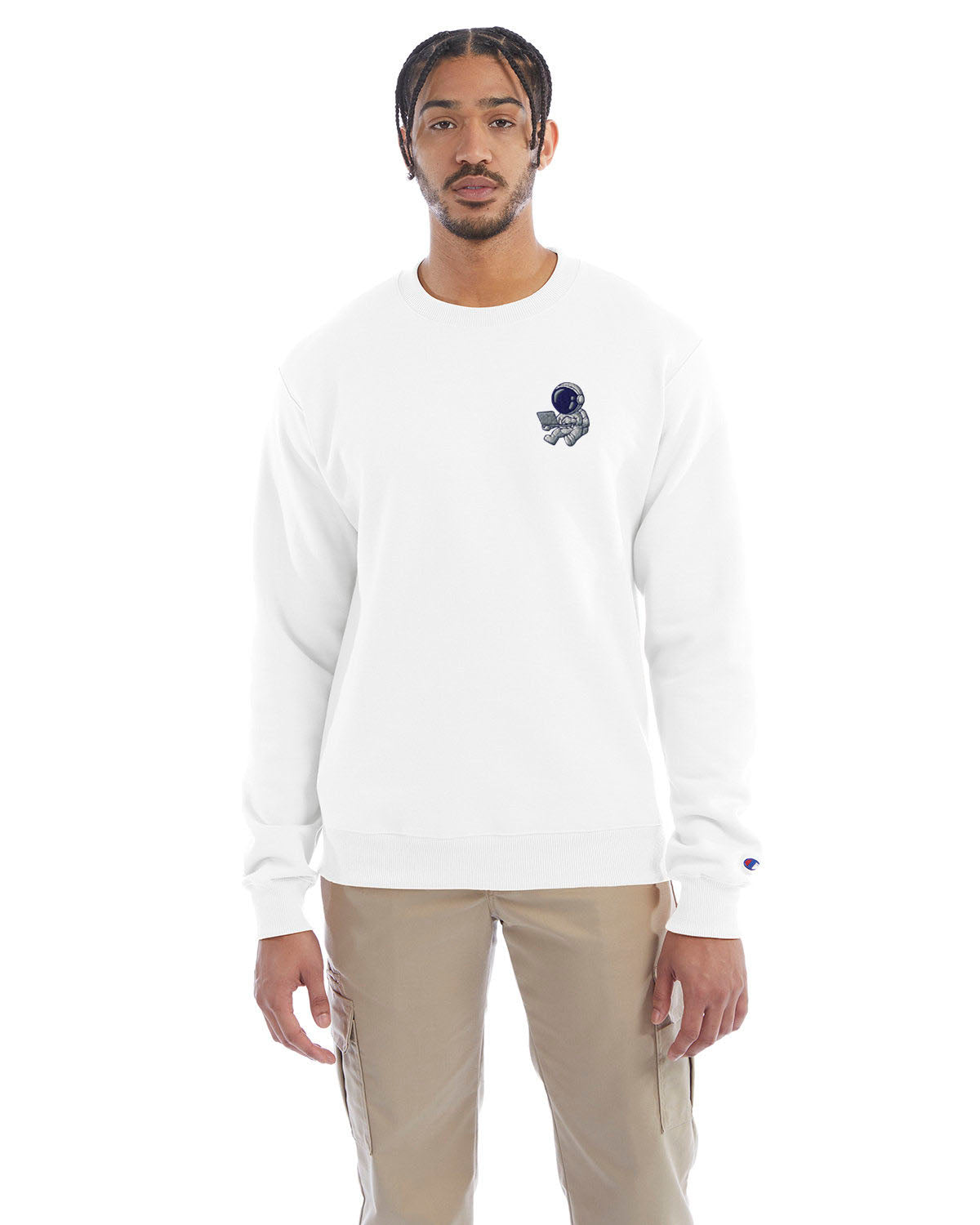 Model wearing white Champion crewneck sweatshirt with custom chest logo.