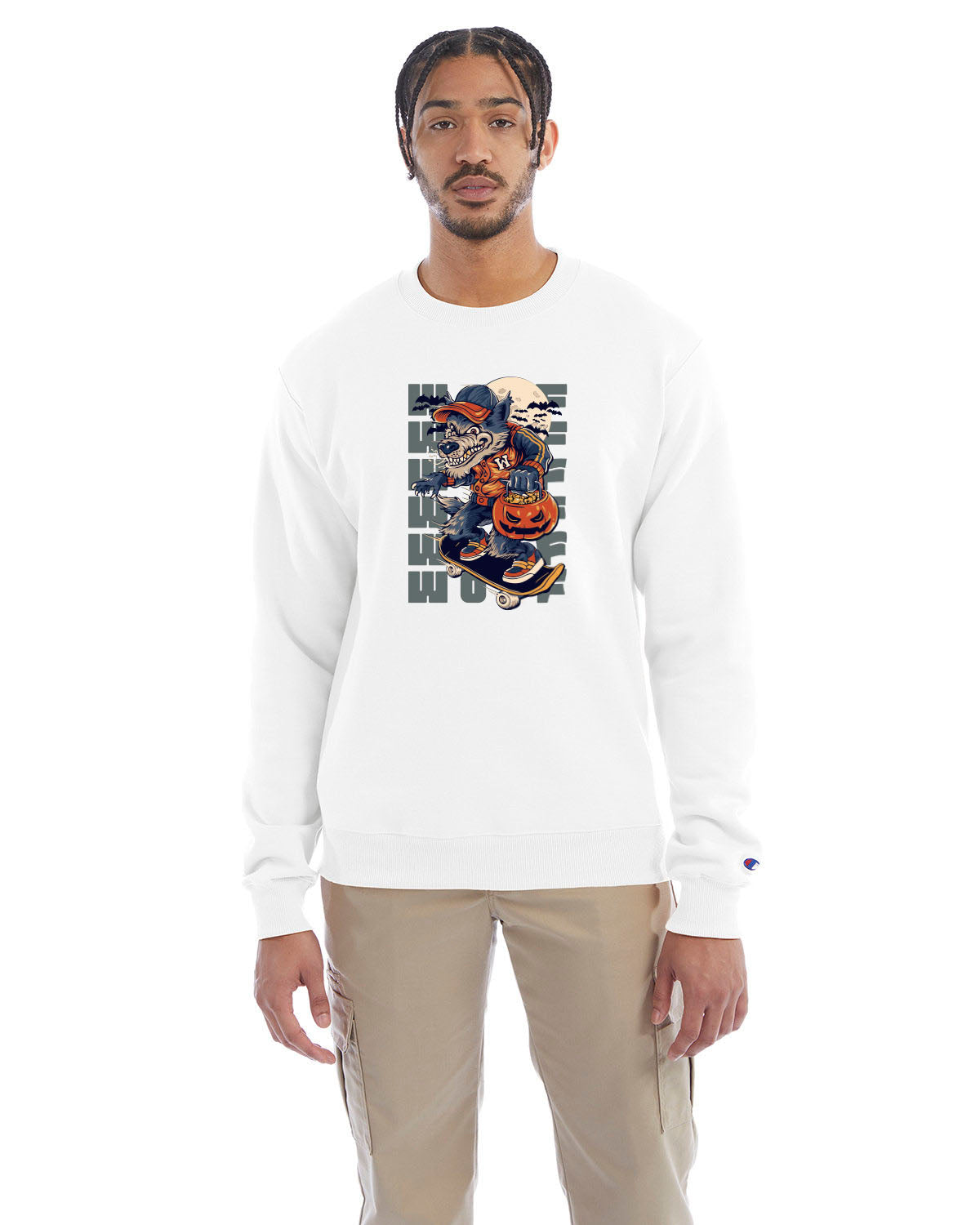 White crewneck sweatshirt with a Halloween-themed graphic of a cartoon werewolf skateboarding with a pumpkin basket, worn by a model in beige pants.
