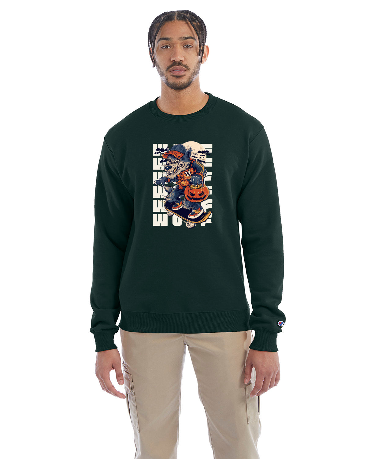 Dark green crewneck sweatshirt with a Halloween-themed graphic of a cartoon werewolf skateboarding with a pumpkin basket, worn by a model in beige pants.