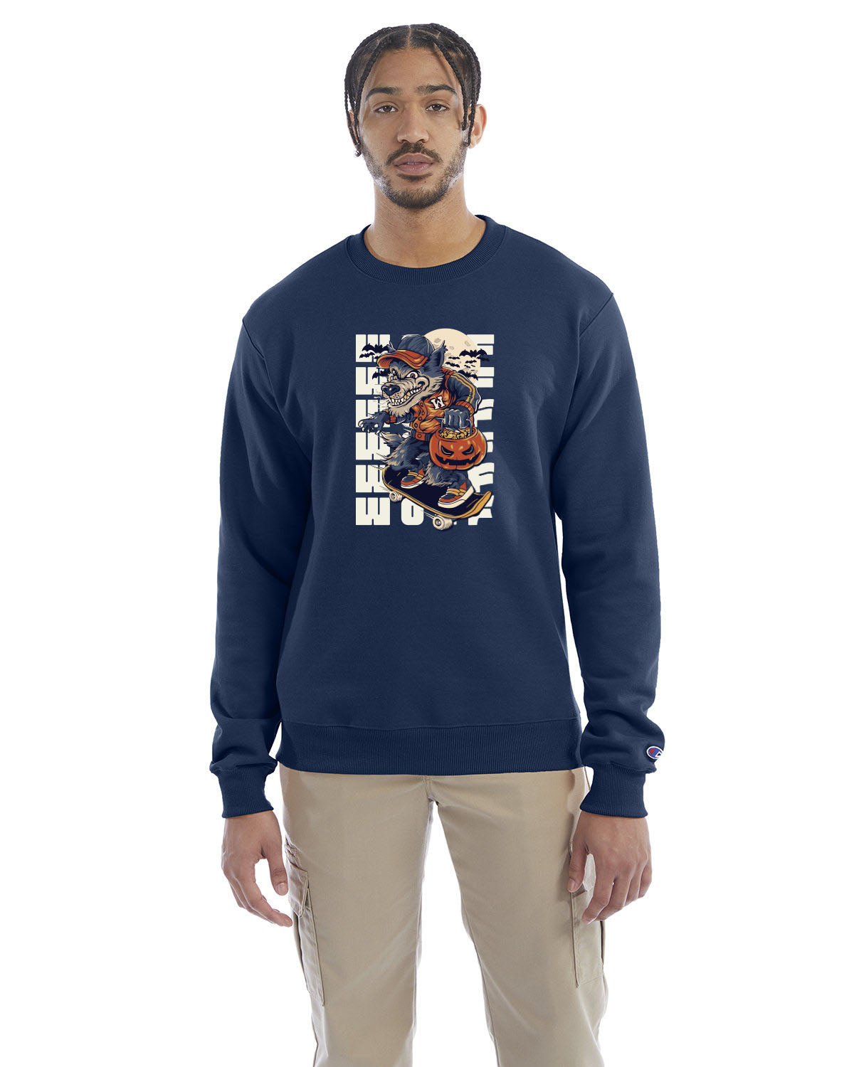 Latenight blue crewneck sweatshirt with a Halloween-themed graphic of a cartoon werewolf skateboarding with a pumpkin basket, worn by a model in beige pants.