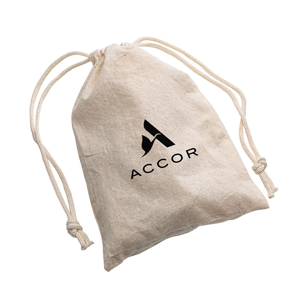 Closed natural cotton drawstring pouch with the black ACCOR logo printed on the front, showcasing knotted cords.