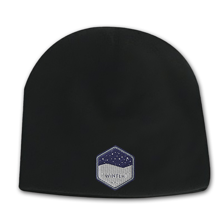 Black deluxe fleece beanie with a hexagon-shaped embroidered patch featuring a snowy night design on the front.