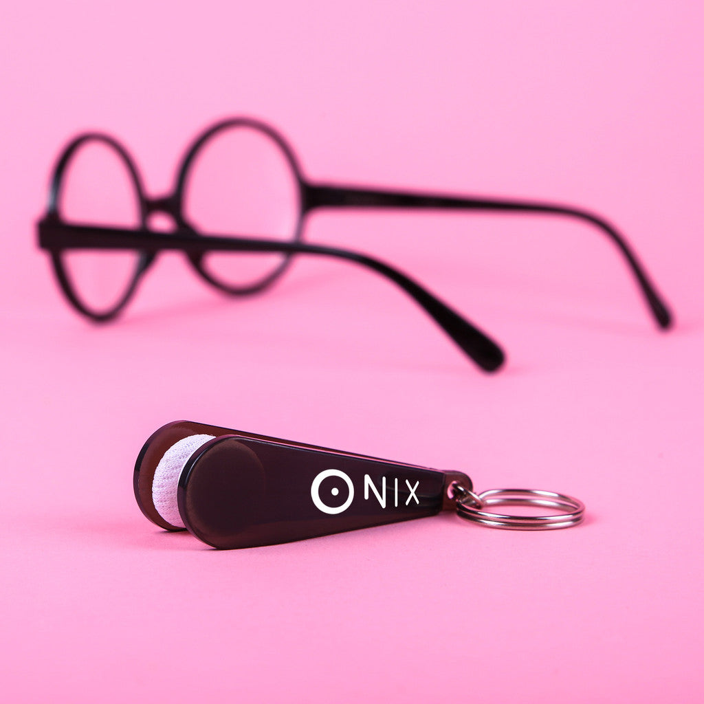 Black eyeglass cleaner keychain featuring a custom logo