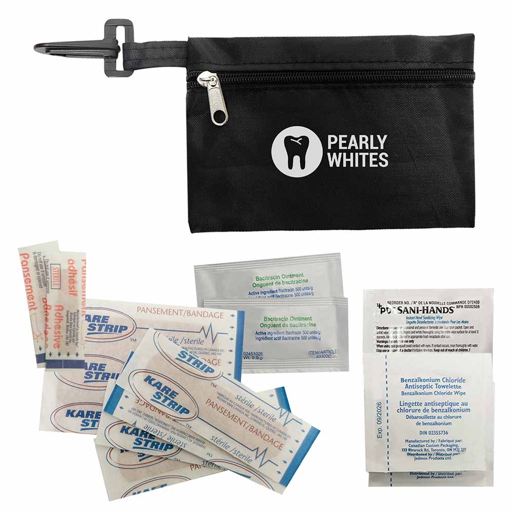 Black first aid pouch with “PEARLY WHITES” logo, surrounded by bandages, antibiotic ointments, and a sanitizing wipe