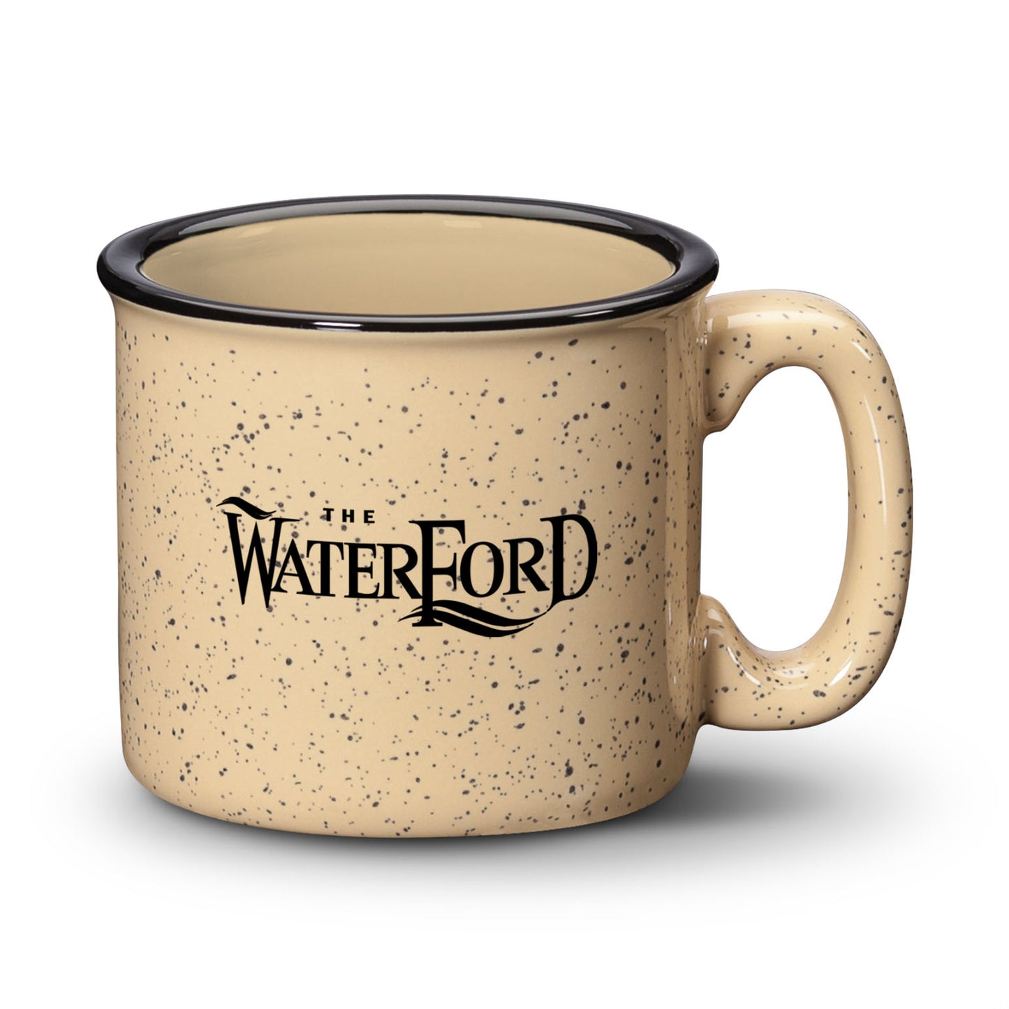 Sand ceramic campfire mug with a speckled finish, black rim, and “The Waterford” logo in bold print.