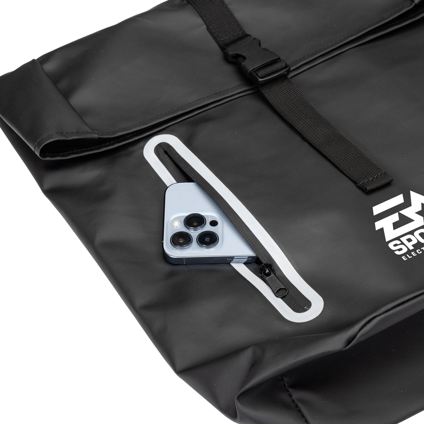Close-up of the Hazen backpack's front zipper pocket with a smartphone partially inserted, highlighting easy-access storage feature.
