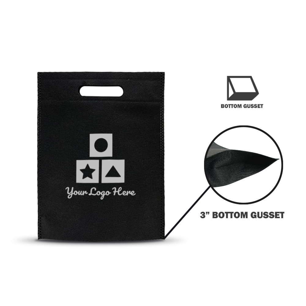 Black non-woven tote bag with die-cut handle and white geometric icon print, featuring a bottom gusset detail magnified to show stitching and material texture