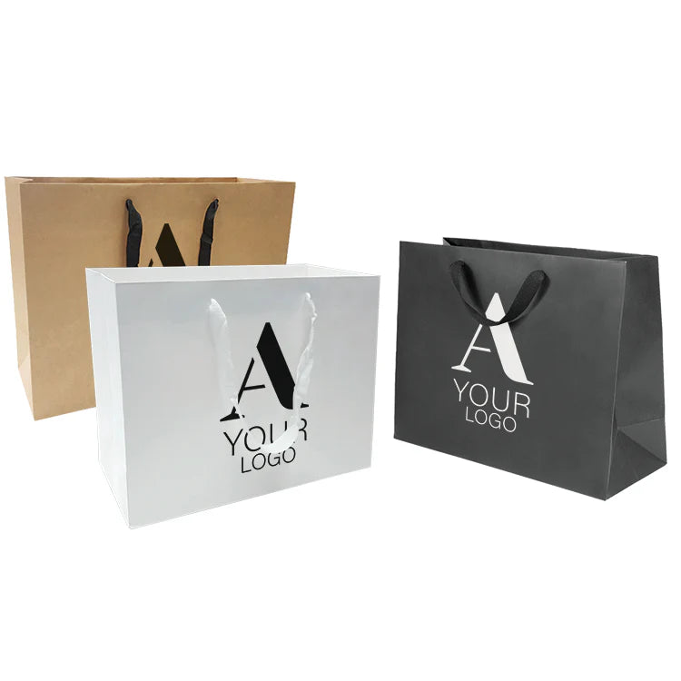 Custom shopping bags in kraft brown, white, and black, each with rope handles and a large "A YOUR LOGO" design on the front.