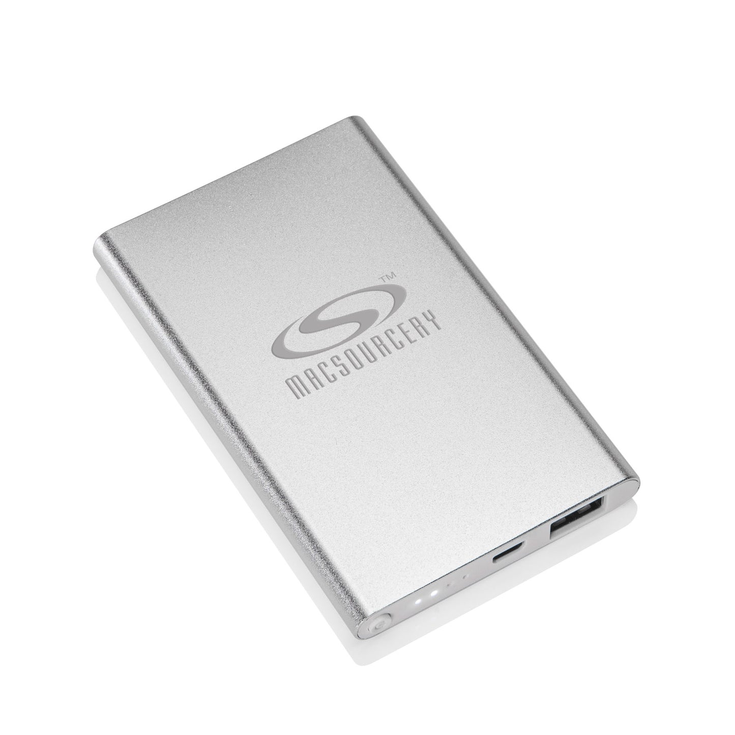 Slim gray portable power bank featuring the "MACSURGERY" logo in silver on the front, with USB ports and LED indicator lights along the edge.