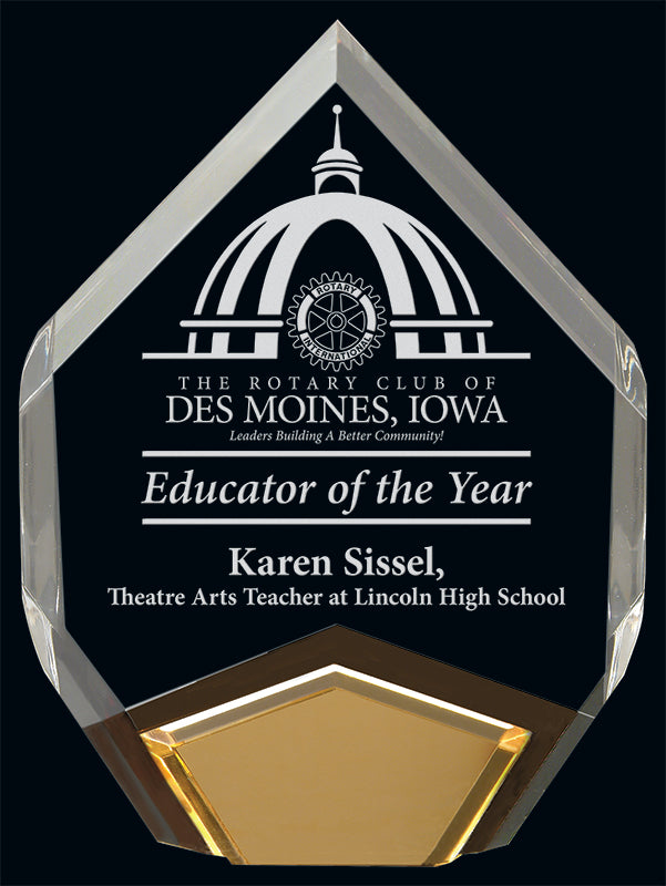 Crystal award with gold base, engraved with the Rotary Club of Des Moines, Iowa logo and presented to Karen Sissel as Educator of the Year for her role as Theatre Arts Teacher at Lincoln High School.