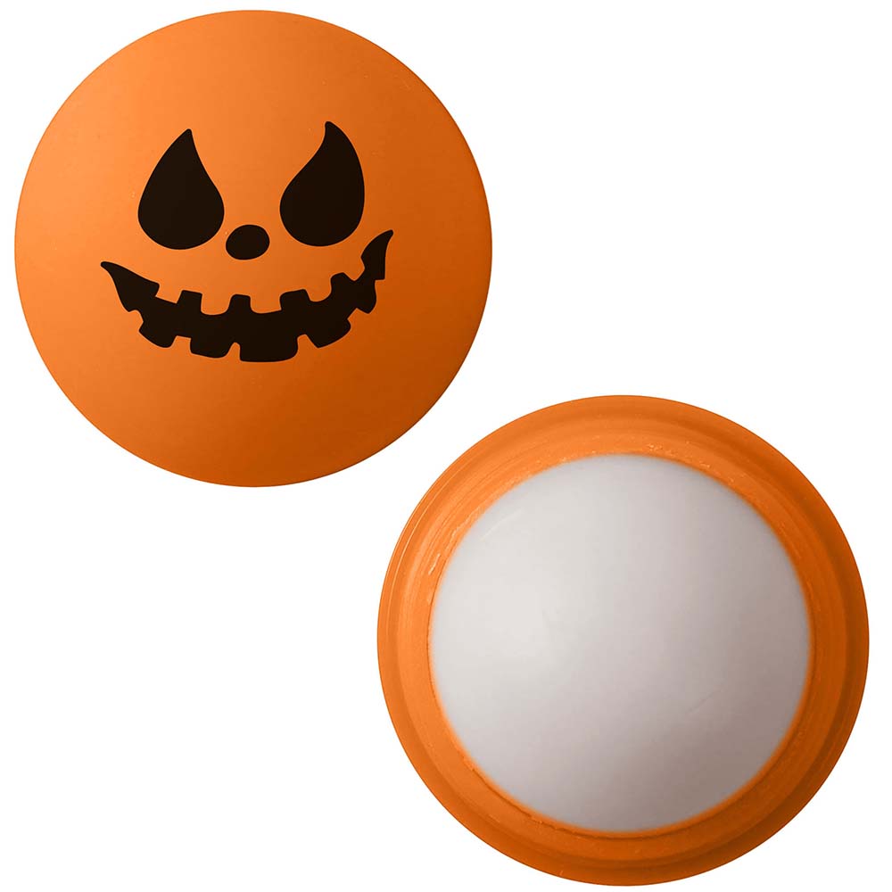 Orange spherical lip balm with a black jack-o'-lantern face design, shown with cap removed.