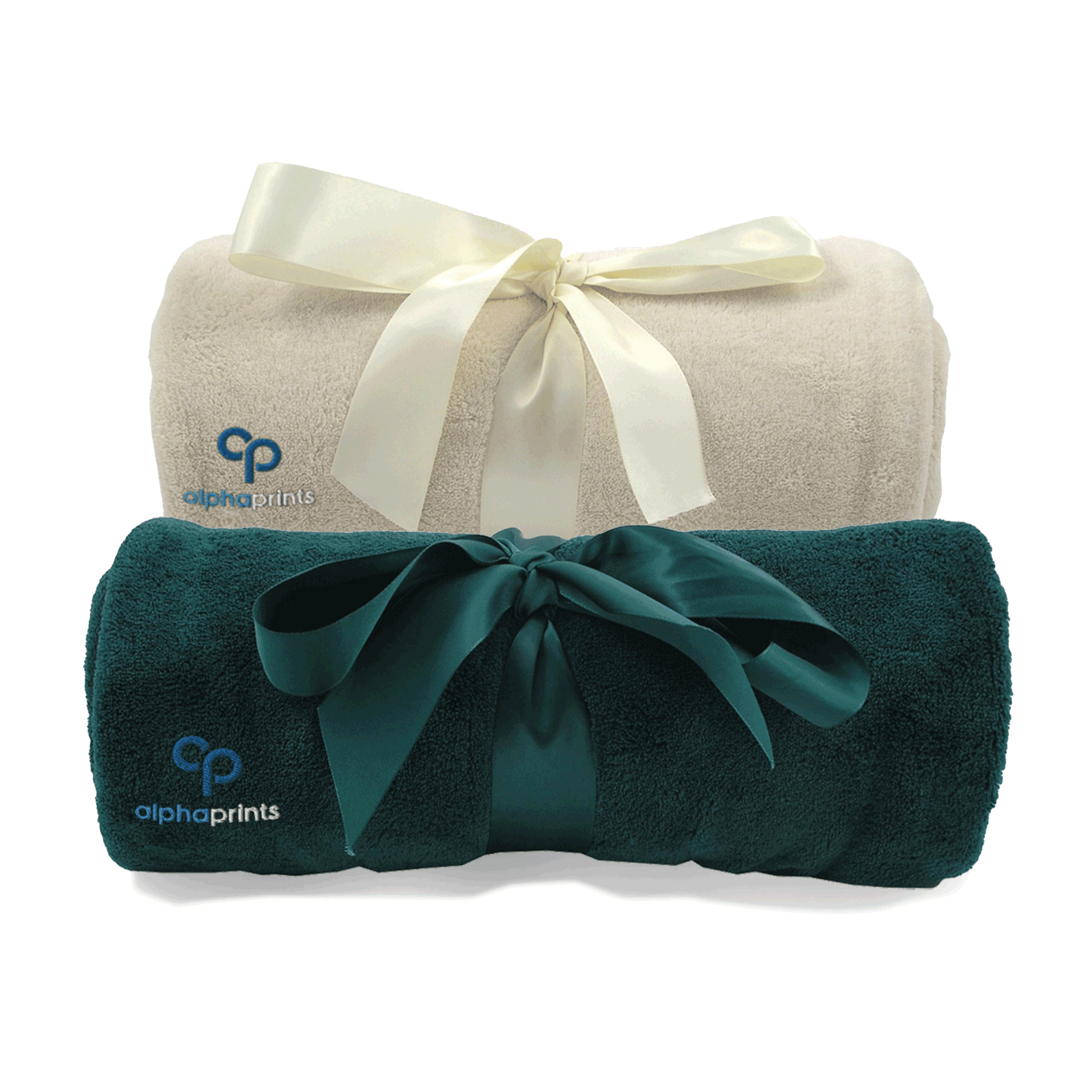 Two rolled plush blankets, one cream and one dark green, each tied with a satin ribbon and embroidered with the 'alphaprints' logo
